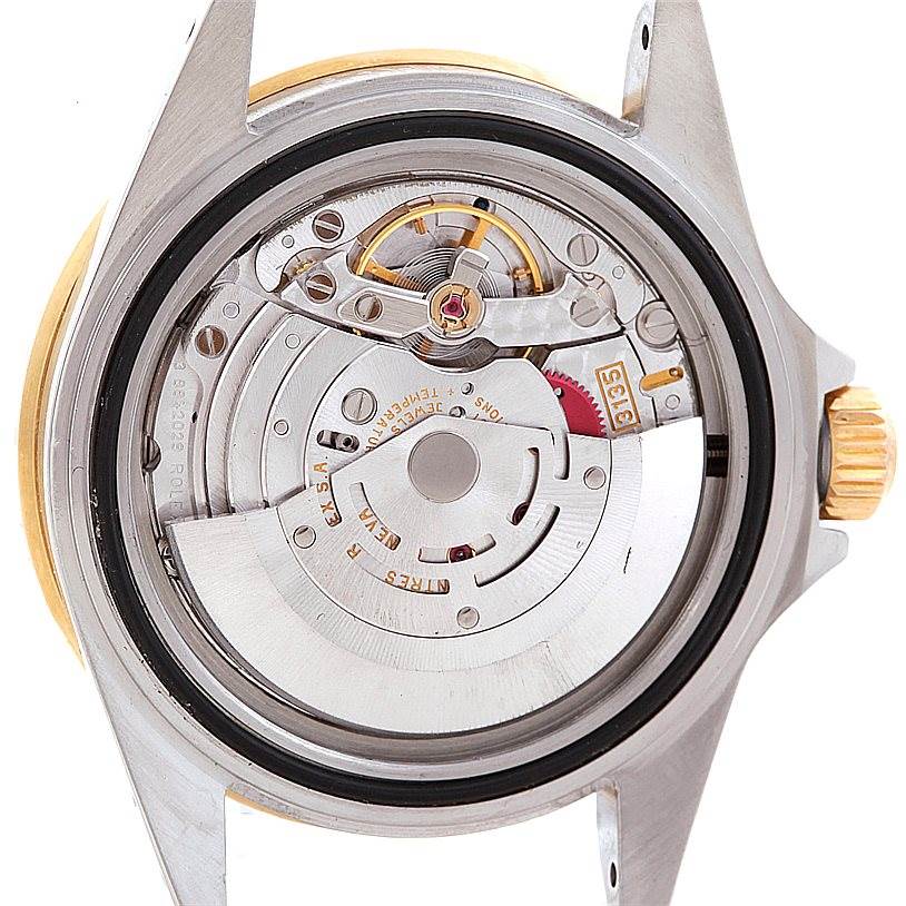 The image shows the back view of the Rolex Submariner 16613 Men's Steel and Gold (two tone) Champagne Dial 16613 Men's Steel and Gold (two tone) Champagne Dial watch, highlighting its internal movement and rotor mechanism.
