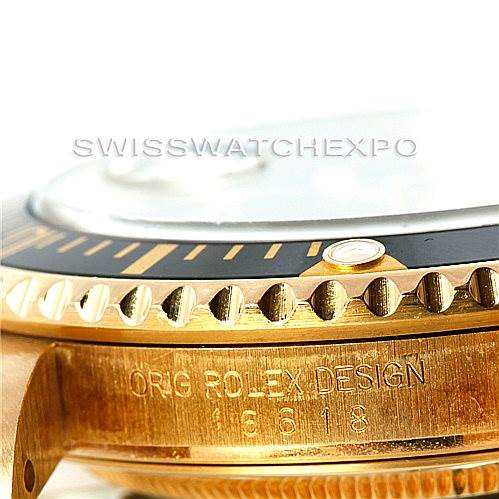 The image shows a close-up of the side view of a Rolex Submariner 16618 Men
s Yellow Gold Black Dial 16618 Men
s Yellow Gold Black Dial, highlighting the bezel and the engraved "ORIG ROLEX DESIGN" text.