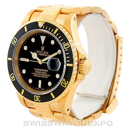 This image shows a Rolex Submariner 16618 Men
s Yellow Gold Black Dial 16618 Men
s Yellow Gold Black Dial watch angled from the front right, displaying its bezel, dial, crown, and part of the bracelet.