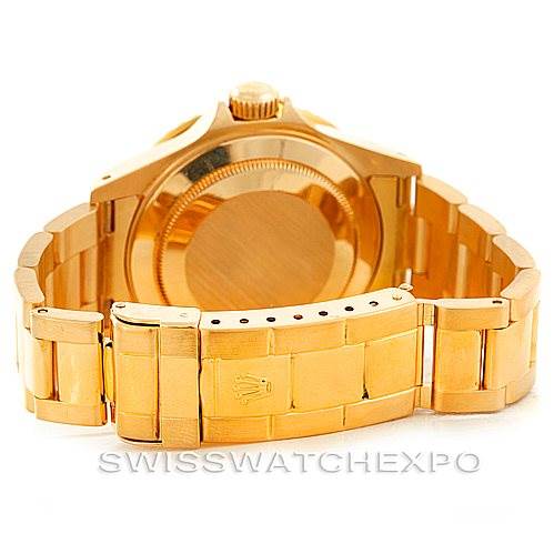 This image shows the back and bracelet clasp of a Rolex Submariner 16618 Men
s Yellow Gold Black Dial 16618 Men
s Yellow Gold Black Dial watch in gold, viewed from a rear angle.