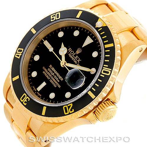 This image shows a Rolex Submariner 16618 Men
s Yellow Gold Black Dial 16618 Men
s Yellow Gold Black Dial watch at a three-quarter angle, focusing on the dial, bezel, crown, and part of the bracelet.