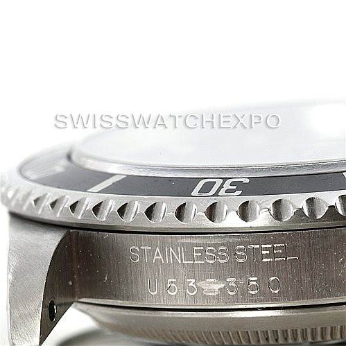 The image shows a close-up of the side and bezel of a Rolex Submariner 14060 Men
s Stainless Steel Black Dial 14060 Men
s Stainless Steel Black Dial, highlighting its stainless steel construction.