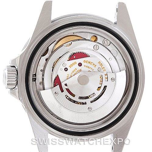 The image shows the internal mechanical movement of a Rolex Submariner 14060 Men
s Stainless Steel Black Dial 14060 Men
s Stainless Steel Black Dial watch from a rear angle with the case back removed.