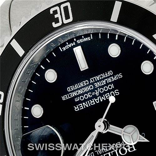 The image shows a close-up of the dial and bezel of a Rolex Submariner 16610 Men
s Stainless Steel Black Dial 16610 Men
s Stainless Steel Black Dial watch, with the "30" marker and details of the face visible.