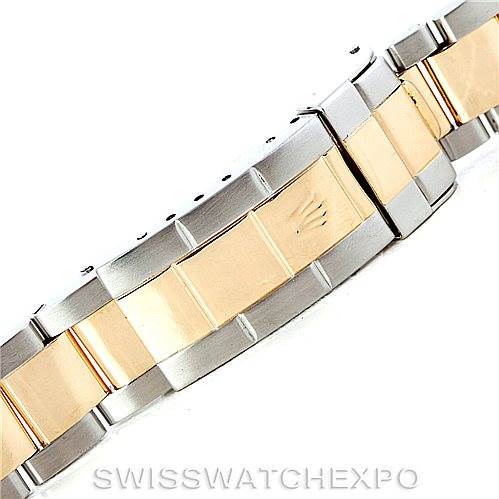 The image shows a close-up of the two-tone bracelet clasp of a Rolex Submariner 16613 Men's Steel and Gold (two tone) Champagne Dial 16613 Men's Steel and Gold (two tone) Champagne Dial watch.
