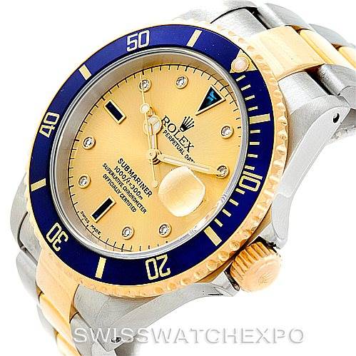 The image shows a close-up view of a Rolex Submariner 16613 Men's Steel and Gold (two tone) Champagne Dial 16613 Men's Steel and Gold (two tone) Champagne Dial watch face, bezel, crown, and part of the bracelet.
