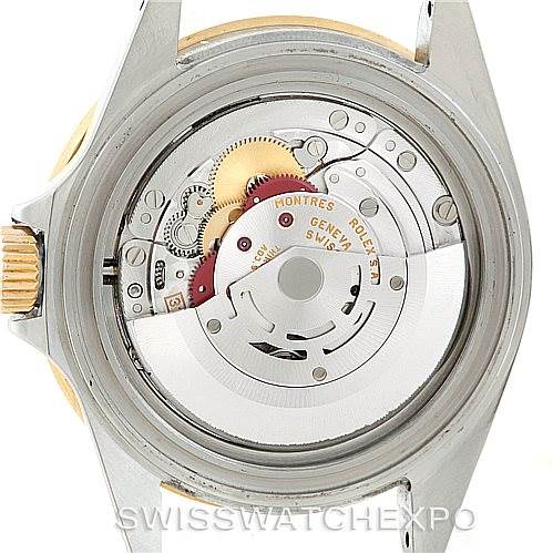 The image shows the case back removed to display the movement of a Rolex Submariner 16613 Men's Steel and Gold (two tone) Champagne Dial 16613 Men's Steel and Gold (two tone) Champagne Dial watch.