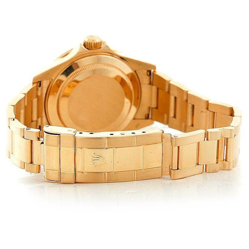 This image shows the back case, crown, and bracelet of the Rolex Submariner 16618 Men
s Yellow Gold Black Dial 16618 Men
s Yellow Gold Black Dial watch in a fully extended view.