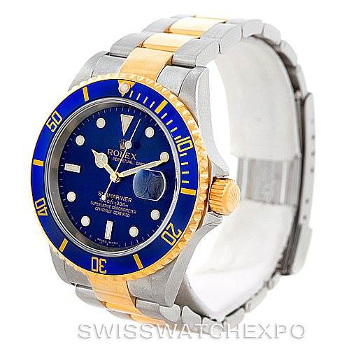 The image shows the Rolex Submariner 16613 Men's Steel and Gold (two tone) Blue Dial 16613 Men's Steel and Gold (two tone) Blue Dial watch at an oblique angle, highlighting the dial, bezel, crown, and bracelet.