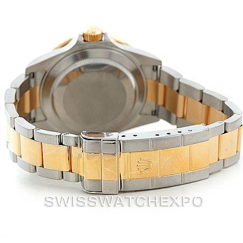 The image shows the back case and two-tone bracelet of a Rolex Submariner 16613 Men's Steel and Gold (two tone) Blue Dial 16613 Men's Steel and Gold (two tone) Blue Dial watch at a rear angle.