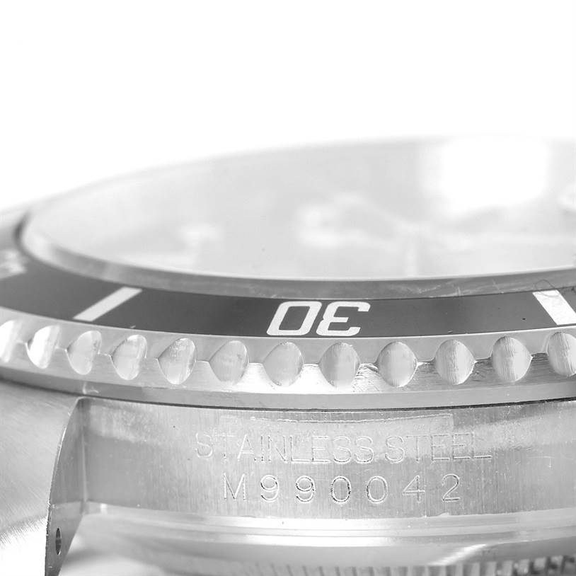 This close-up image shows the bezel and engraved case side of a Rolex Submariner 16610 Men
s Stainless Steel Black Dial 16610 Men
s Stainless Steel Black Dial watch.