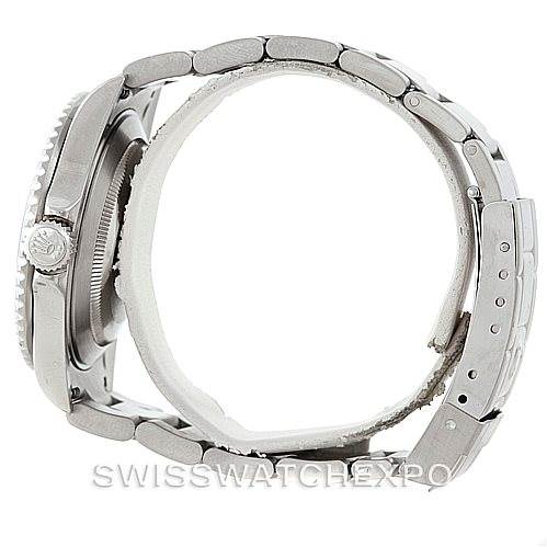 The image shows a side view of the Rolex Submariner 16610 Men
s Stainless Steel Black Dial 16610 Men
s Stainless Steel Black Dial, focusing on the case, bezel, crown, and bracelet.