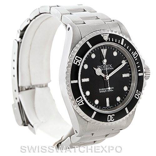 The image shows a Rolex Submariner watch at a slight angle, highlighting the face, bezel, and part of the bracelet.