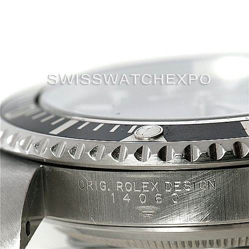 The image shows a side angle of the Rolex Submariner 14060 Men
s Stainless Steel Black Dial 14060 Men
s Stainless Steel Black Dial, displaying the case, bezel, and part of the crystal with the model number.