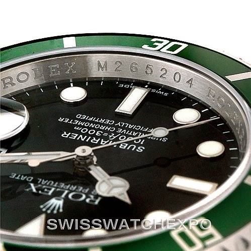 This image shows a close-up of the Rolex Submariner 16610V Men
s Stainless Steel Black Dial 16610V Men
s Stainless Steel Black Dial watch, focusing on the bezel, dial, and part of the hands.