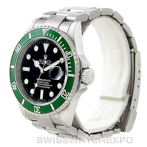 This image shows a angled view of a Rolex Submariner 16610V Men
s Stainless Steel Black Dial 16610V Men
s Stainless Steel Black Dial watch featuring its green bezel, black dial, cyclops lens, and stainless steel bracelet.