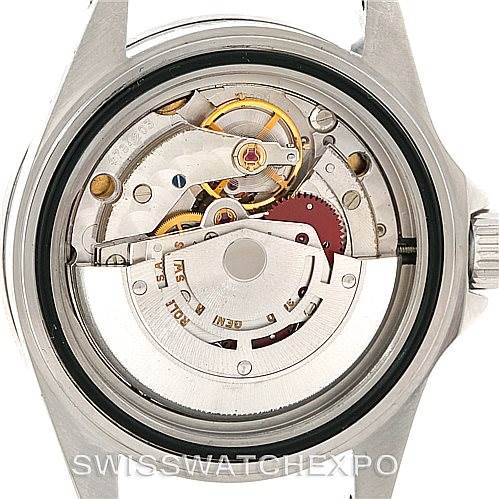 This image shows a back view of the Rolex Submariner 14060 Men
s Stainless Steel Black Dial 14060 Men
s Stainless Steel Black Dial revealing its intricate internal mechanism and movement components.