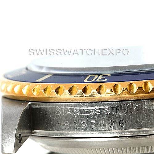 This image shows a close-up side view of a Rolex Submariner 16613 Men's Steel and Gold (two tone) Blue Dial 16613 Men's Steel and Gold (two tone) Blue Dial watch, highlighting the bezel, part of the dial, and some engravings.