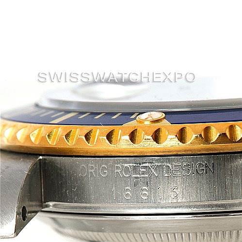 Close-up angle showing the case side of a Rolex Submariner 16613 Men's Steel and Gold (two tone) Blue Dial 16613 Men's Steel and Gold (two tone) Blue Dial, including the bezel and model number engraving.