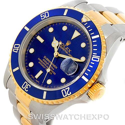 The image shows a Rolex Submariner 16613 Men's Steel and Gold (two tone) Blue Dial 16613 Men's Steel and Gold (two tone) Blue Dial model watch from a top-front angle, highlighting the dial, bezel, and partial bracelet.