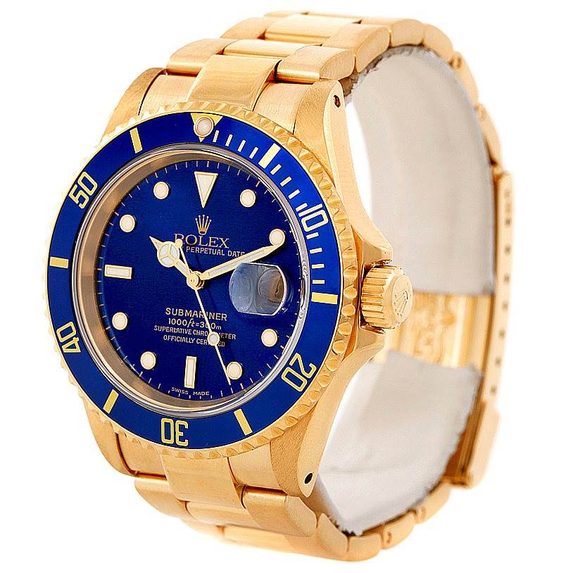 This image shows a Rolex Submariner 16618 Men
s Yellow Gold Blue Dial 16618 Men
s Yellow Gold Blue Dial watch from a slight right side angle, highlighting its blue dial, bezel, and gold bracelet.
