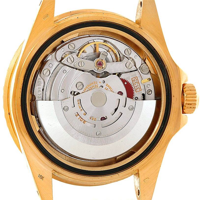 The image shows the internal movement and mechanisms of a Rolex Submariner 16618 Men
s Yellow Gold Blue Dial 16618 Men
s Yellow Gold Blue Dial watch viewed from the back.