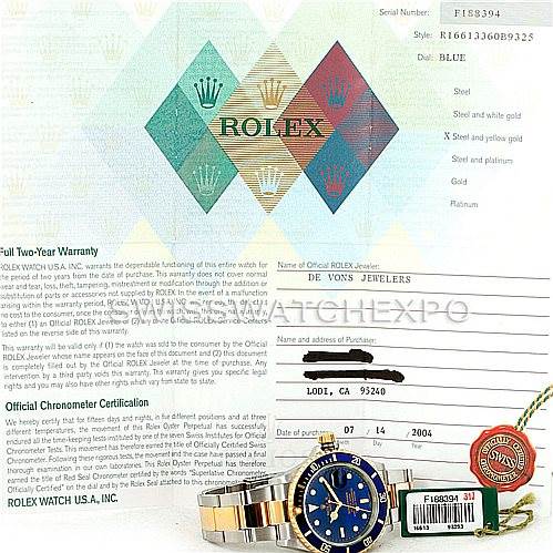The image shows a Rolex Submariner 16613 Men
s Steel and Gold (two tone) Blue Dial 16613 Men
s Steel and Gold (two tone) Blue Dial watch and its accessories, including the warranty card, tags, and certification documents.