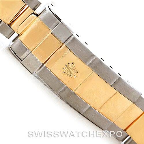 This image shows a close-up of the two-tone bracelet and clasp of a Rolex Submariner 16613 Men's Steel and Gold (two tone) Champagne Dial 16613 Men's Steel and Gold (two tone) Champagne Dial watch.