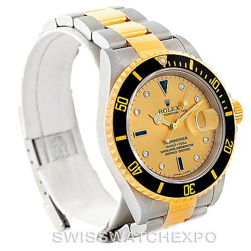 The image shows a Rolex Submariner 16613 Men's Steel and Gold (two tone) Champagne Dial 16613 Men's Steel and Gold (two tone) Champagne Dial watch at a slight angle, displaying the face, bezel, and part of the bracelet.