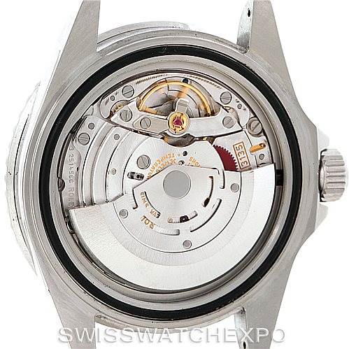 The image shows the internal mechanical movement parts of a Rolex Submariner 16610V Men
s Stainless Steel Black Dial 16610V Men
s Stainless Steel Black Dial watch viewed from the back.