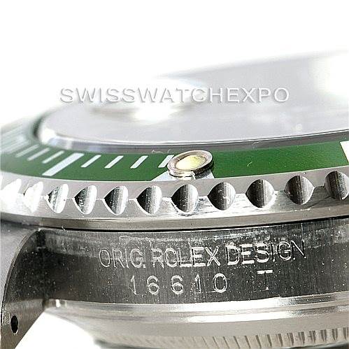 The image shows a close-up angle of the bezel, dial, and case side of a Rolex Submariner 16610V Men
s Stainless Steel Black Dial 16610V Men
s Stainless Steel Black Dial watch with the engraved model number 16610.