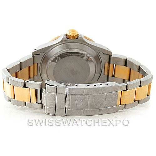 The image shows the back and clasp of a Rolex Submariner 16613 Men's Steel and Gold (two tone) Blue Dial 16613 Men's Steel and Gold (two tone) Blue Dial watch, highlighting its two-tone metal bracelet.