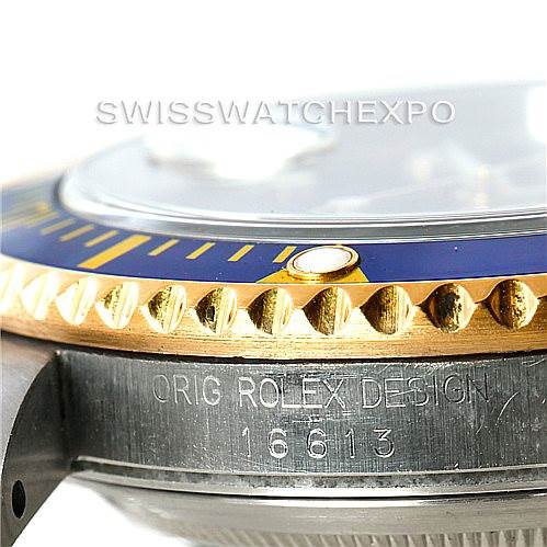 This image shows a close-up of the side engraving and bezel of a Rolex Submariner 16613 Men's Steel and Gold (two tone) Blue Dial 16613 Men's Steel and Gold (two tone) Blue Dial model.