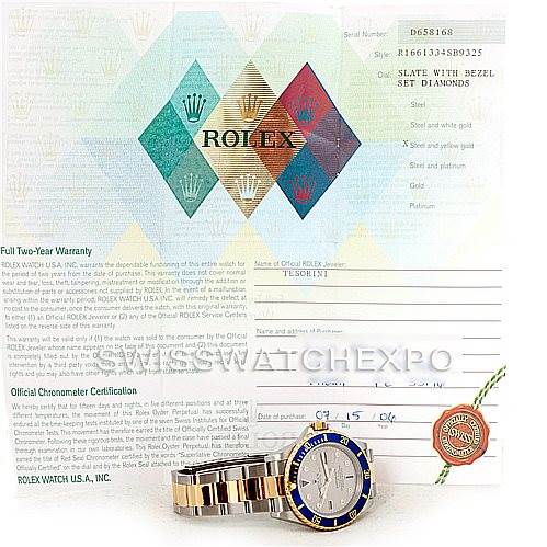 The image shows a Rolex Submariner 16613 Men's Steel and Gold (two tone) Grey Dial 16613 Men's Steel and Gold (two tone) Grey Dial model watch with a blue and gold bezel, part of the bracelet, and its certification papers.