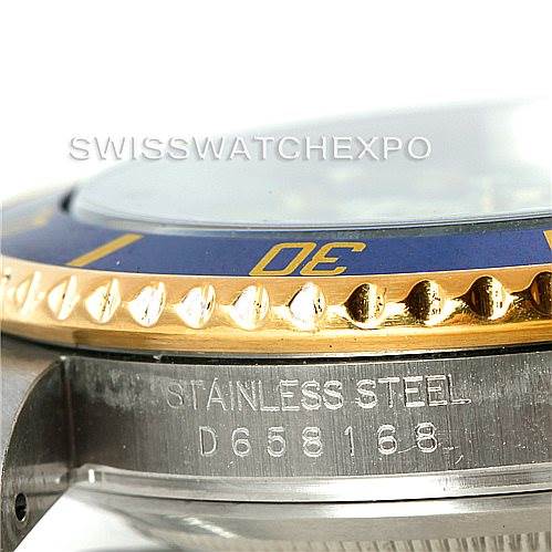 The image shows a close-up angle of the side of a Rolex Submariner 16613 Men's Steel and Gold (two tone) Grey Dial 16613 Men's Steel and Gold (two tone) Grey Dial watch, highlighting the stainless steel case and part of the bezel.