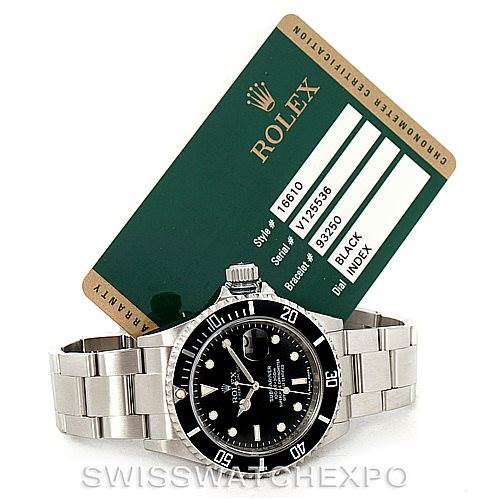 The image shows a Rolex Submariner 16610 Men
s Stainless Steel Black Dial 16610 Men
s Stainless Steel Black Dial watch from a front-angle, accompanied by its certification card.