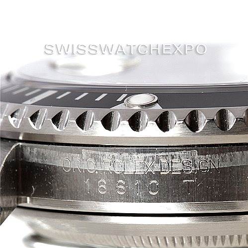 This image shows a close-up side view of the bezel and case of a Rolex Submariner 16610 Men
s Stainless Steel Black Dial 16610 Men
s Stainless Steel Black Dial watch, featuring "ORIG ROLEX DESIGN 16610 T" engraving.