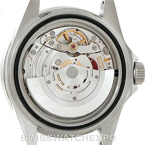 The image shows the back view of a Rolex Submariner 16610 Men
s Stainless Steel Black Dial 16610 Men
s Stainless Steel Black Dial watch, displaying its internal mechanical movement.