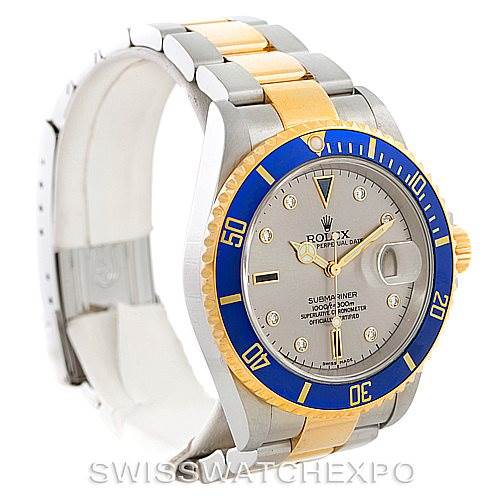 This image shows a Rolex Submariner 16613 Men
s Steel and Gold (two tone) Grey Dial 16613 Men
s Steel and Gold (two tone) Grey Dial watch at an angle displaying the face, bezel, and part of the bracelet.