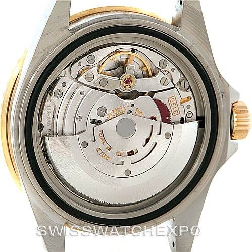 This image shows the internal mechanism of a Rolex Submariner 16613 Men
s Steel and Gold (two tone) Grey Dial 16613 Men
s Steel and Gold (two tone) Grey Dial watch, focusing on the movement components from the back.