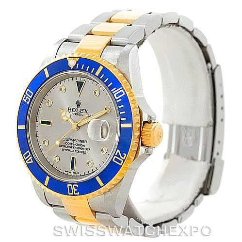 This Rolex Submariner 16613 Men
s Steel and Gold (two tone) Grey Dial 16613 Men
s Steel and Gold (two tone) Grey Dial watch is shown at a three-quarter angle, highlighting the face, bezel, and bracelet.