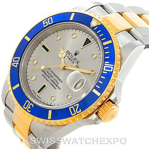 The image shows a Rolex Submariner 16613 Men
s Steel and Gold (two tone) Grey Dial 16613 Men
s Steel and Gold (two tone) Grey Dial watch at an angled view, highlighting the face, bezel, crown, and part of the bracelet.