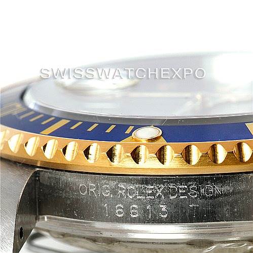 The image shows a close-up side view of the bezel and case with the model number engraving on the Rolex Submariner 16613 Men
s Steel and Gold (two tone) Grey Dial 16613 Men
s Steel and Gold (two tone) Grey Dial watch.