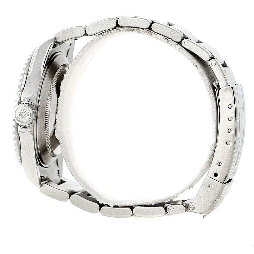 The image shows a side view of the Rolex Submariner 16610V Men
s Stainless Steel Black Dial 16610V Men
s Stainless Steel Black Dial watch, highlighting its bracelet, crown, and side profile of the case.