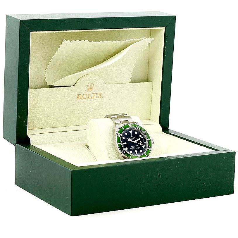 This image shows a Rolex Submariner 16610V Men
s Stainless Steel Black Dial 16610V Men
s Stainless Steel Black Dial watch in its opened presentation box, angled slightly from the front-left.