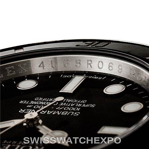 This close-up image shows the dial and inner bezel of a Rolex Submariner 114060 Men
s Stainless Steel Black Dial 114060 Men
s Stainless Steel Black Dial watch at an angle, highlighting engravings and markers.