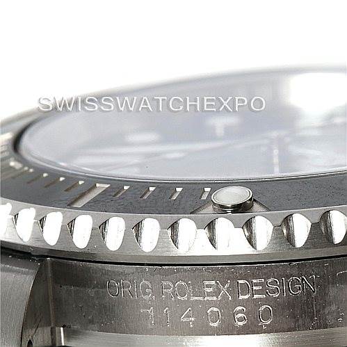 The image shows a close-up side view of the bezel, crystal, and case of the Rolex Submariner 114060 Men
s Stainless Steel Black Dial 114060 Men
s Stainless Steel Black Dial watch, highlighting the engravings.