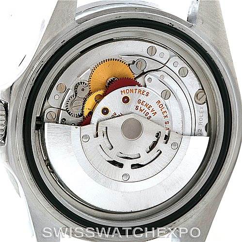 The image shows a close-up view of the movement mechanism inside the case back of a Rolex Submariner 16610 Men
s Stainless Steel Black Dial 16610 Men
s Stainless Steel Black Dial watch.