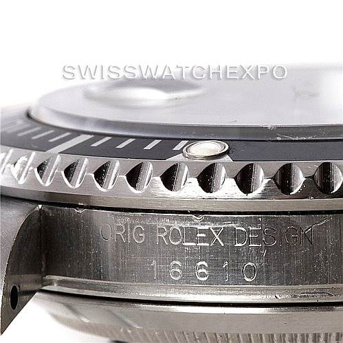 The image shows a close-up side view of a Rolex Submariner 16610 Men
s Stainless Steel Black Dial 16610 Men
s Stainless Steel Black Dial, focusing on the bezel, detail edges, and part of the case with the model number 16610.