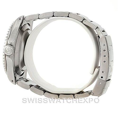 The image shows a side profile view of a Rolex Submariner 16610 Men
s Stainless Steel Black Dial 16610 Men
s Stainless Steel Black Dial, highlighting the bracelet and clasp.